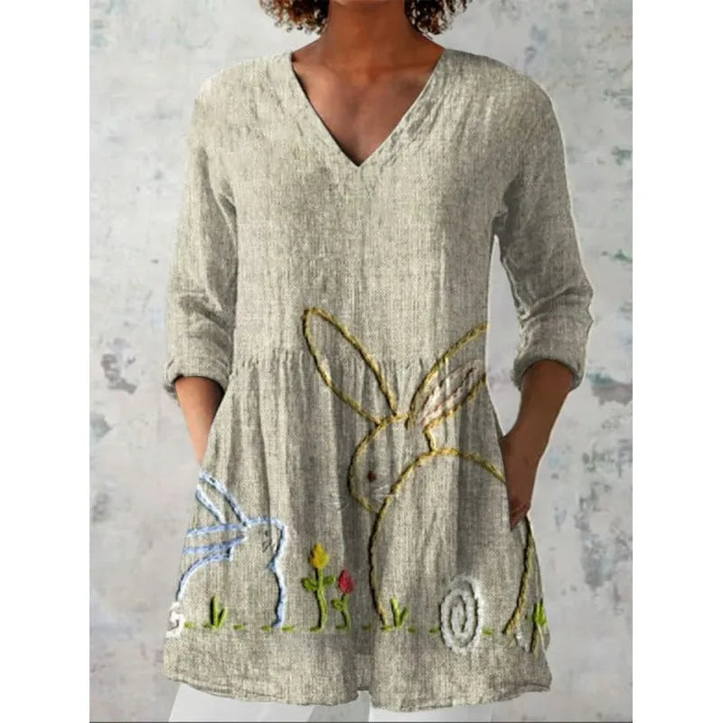 Women's printed wave pattern loose dress with wide waist and 3/4 length sleeves.