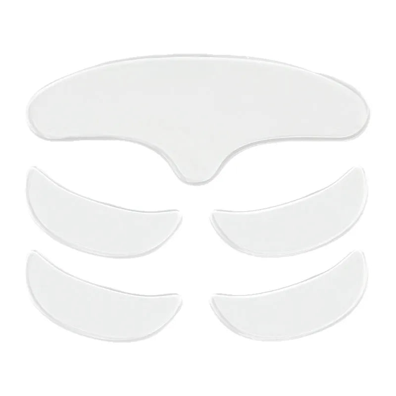 Five silicone anti-wrinkle face stickers arranged on white background