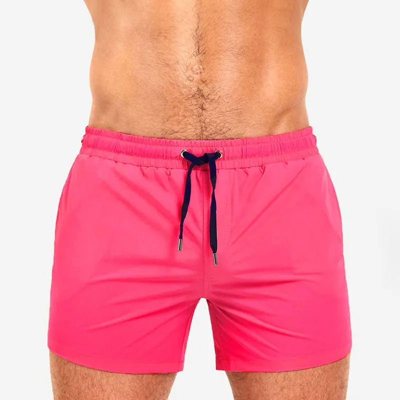 Solid colour polyester swimming and sports shorts with mesh lining in army green, on a white background.
