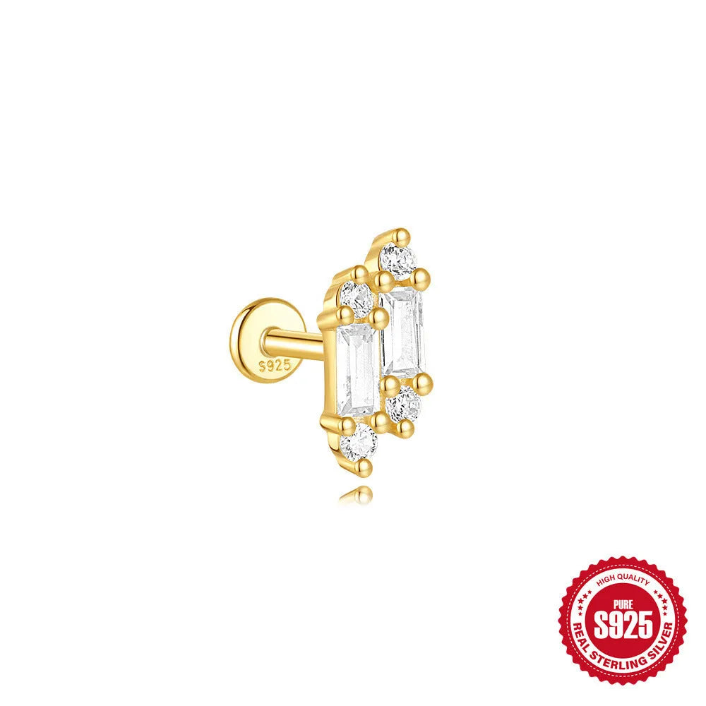 Geometric kite-shaped sterling silver stud earrings with rhinestones and a gold chain tassel.