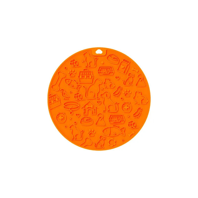 Round grey silicone pet lick mat with textured surface and a clear suction cup on its base.