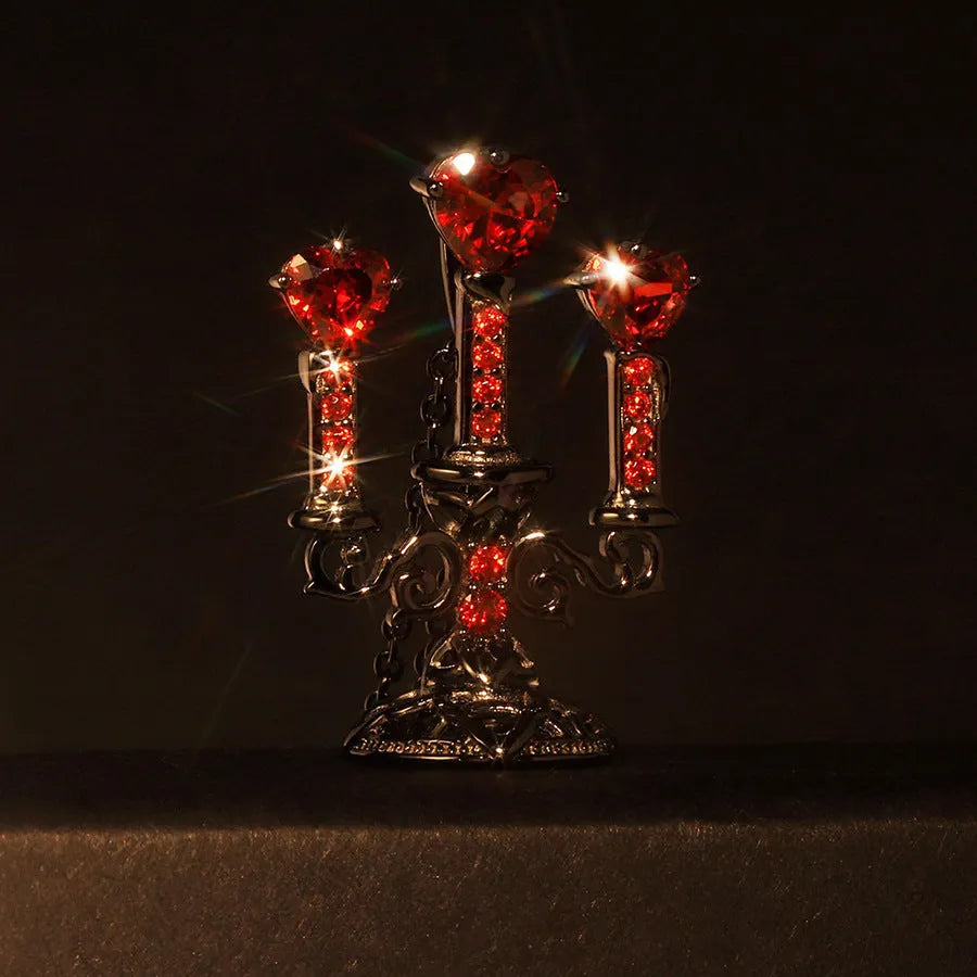 Close-up of a Gothic zinc alloy clavicle chain with a detailed hollow candlestick pendant on a cross chain.