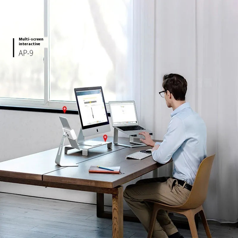 Black aluminium alloy laptop stand on a desk, showing its raised platform and dimensions.