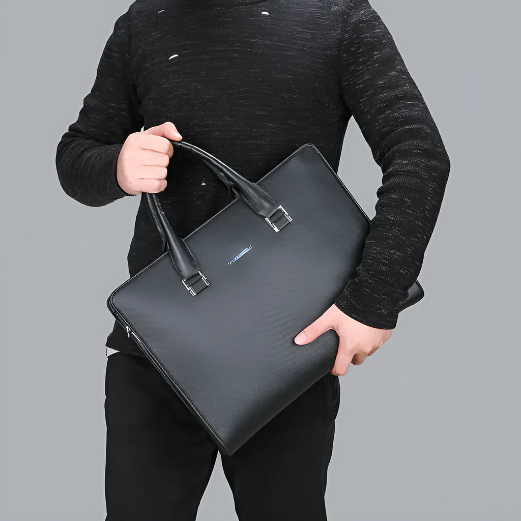 One-shoulder cross-slung male business briefcase in PU leather, horizontal square shape, black colour, zipper closure, stitched detailing