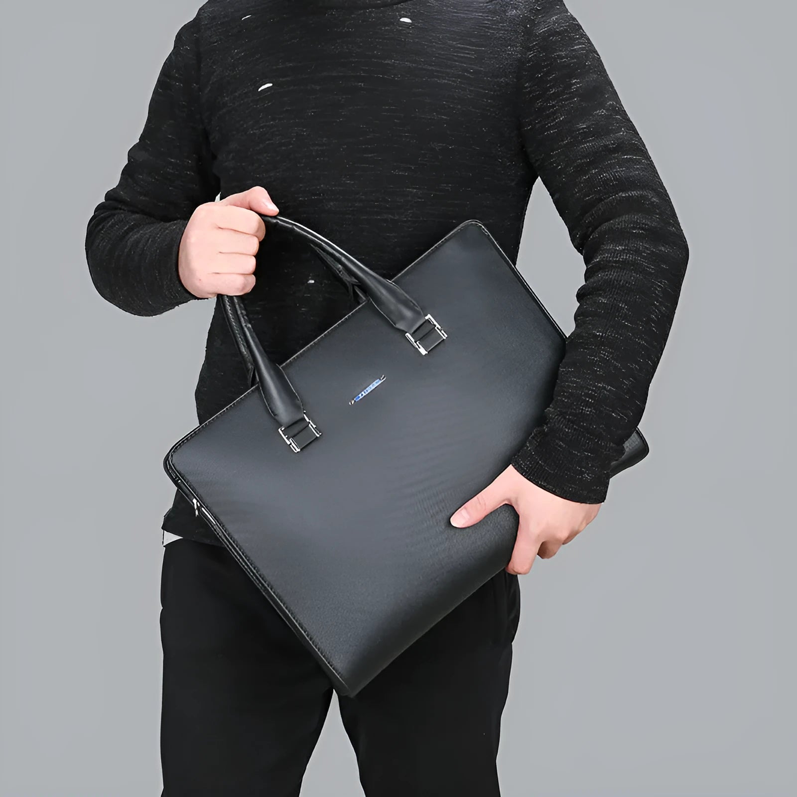 One-shoulder cross-slung male business briefcase in PU leather, horizontal square shape, black colour, zipper closure, stitched detailing