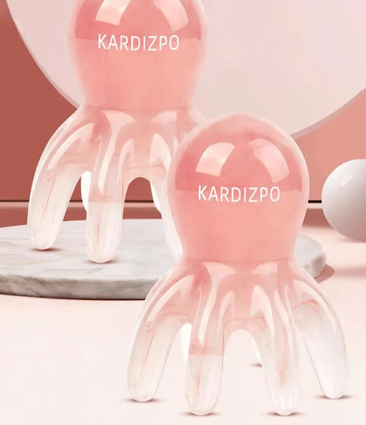 Small pink octopus-shaped massage comb for periocular meridian massage with natural resin material