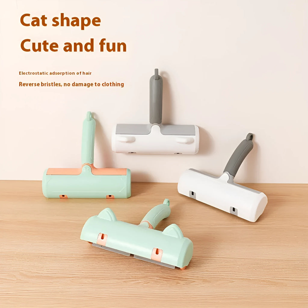 Mint green manual brush for removing cat hair from furniture and fabrics, showing its size.
