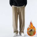 Men's apricot double-sided polar fleece trousers with a wool lining, shown with a drawstring waist.