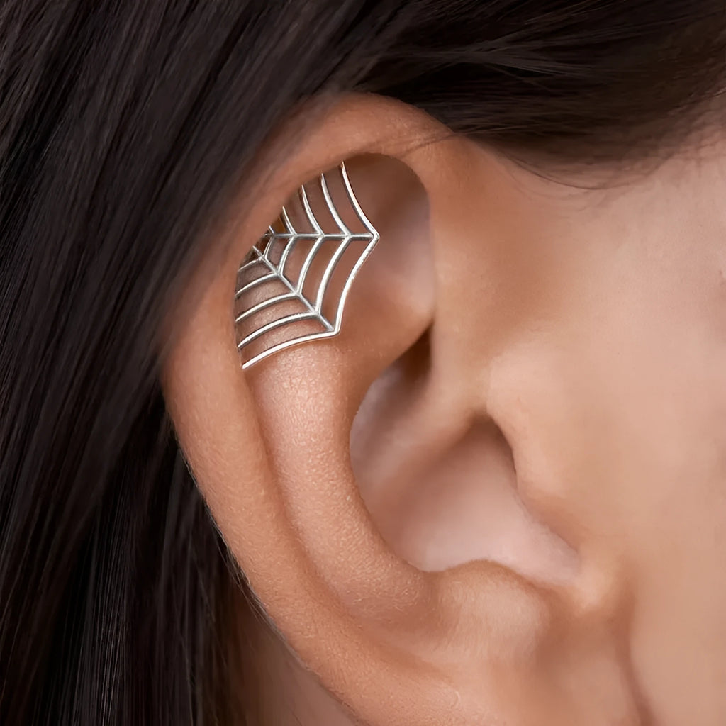 Geometric spider web stud earrings with electroplated gold and silver metallic finishes