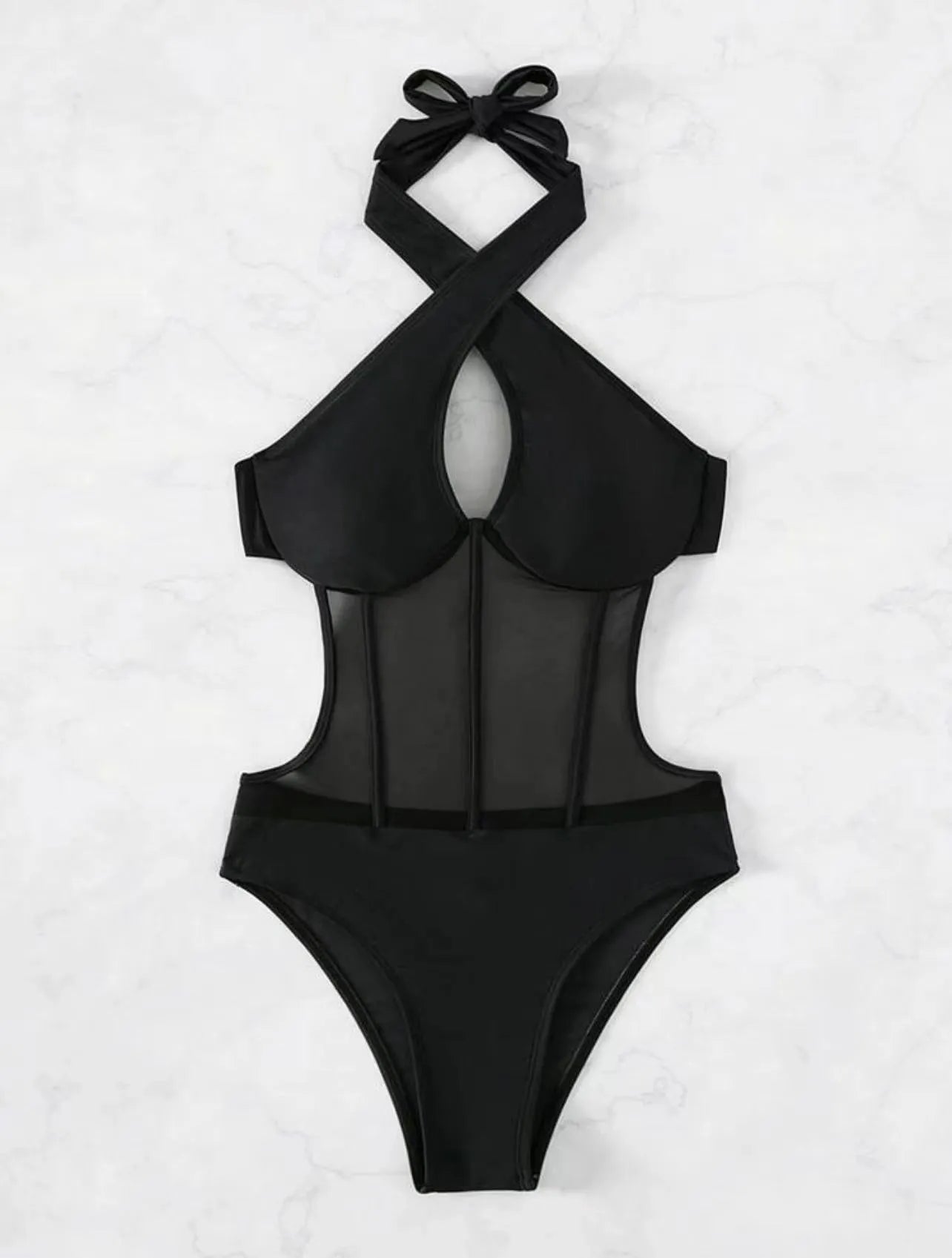 A black ladies one-piece swimsuit bikini made from nylon and spandex fabric on a neutral background.