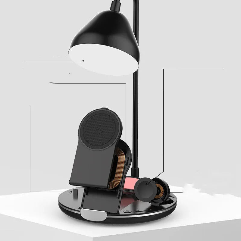 Black magnetic folding wireless charger unfolded showing phone, earbuds, and watch on charging pads