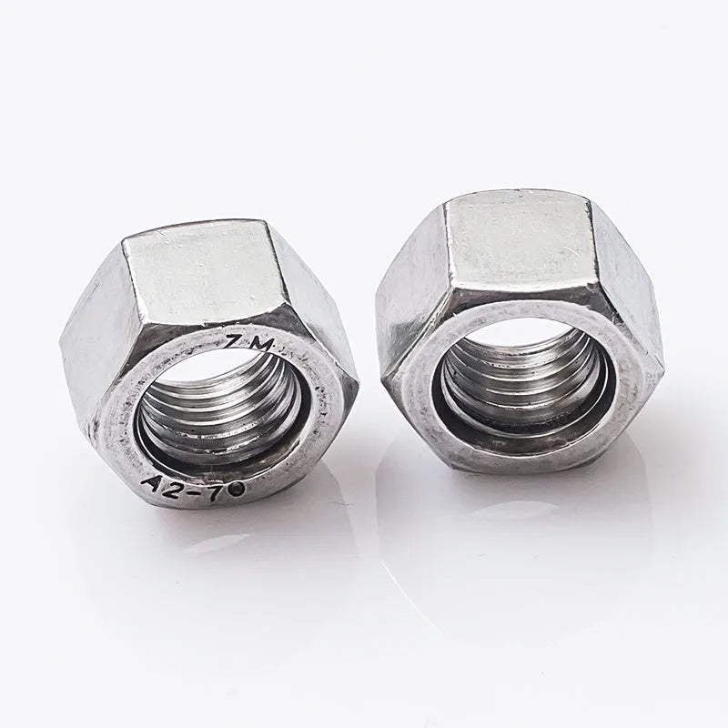 304 stainless steel thickened hex nut assortment from M6 to M56 metric sizes on grey background