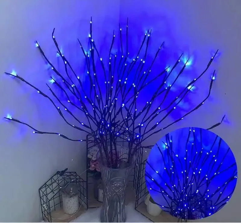 LED decorative tree light in a vase with silver branches illuminated in a choice of six colours.