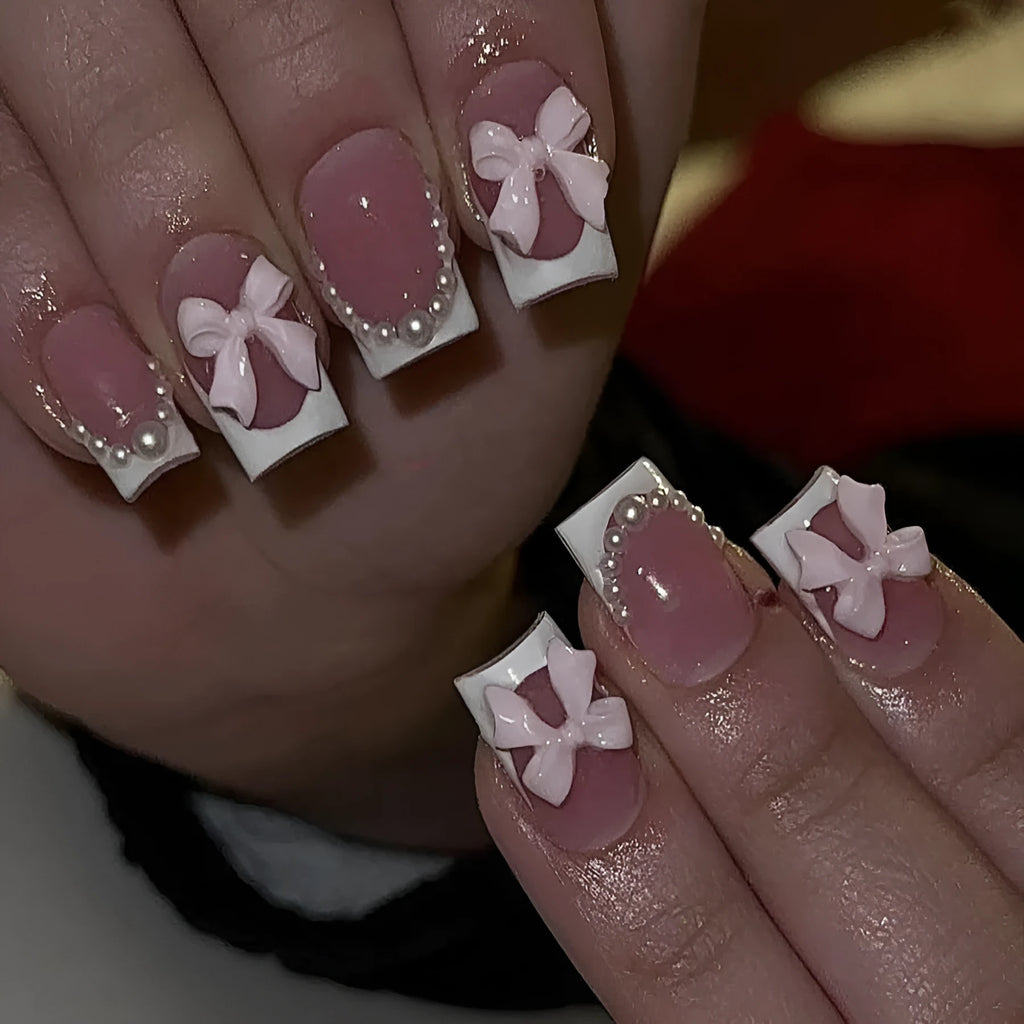 Short white French artificial nails with bow and tulip designs in European square shape