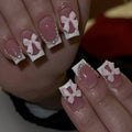 Short white French artificial nails with bow and tulip designs in European square shape