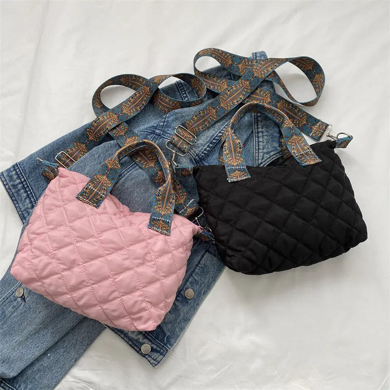A soft Oxford cloth messenger bag in a horizontal square shape with a single shoulder strap, shown in one of five available colours.