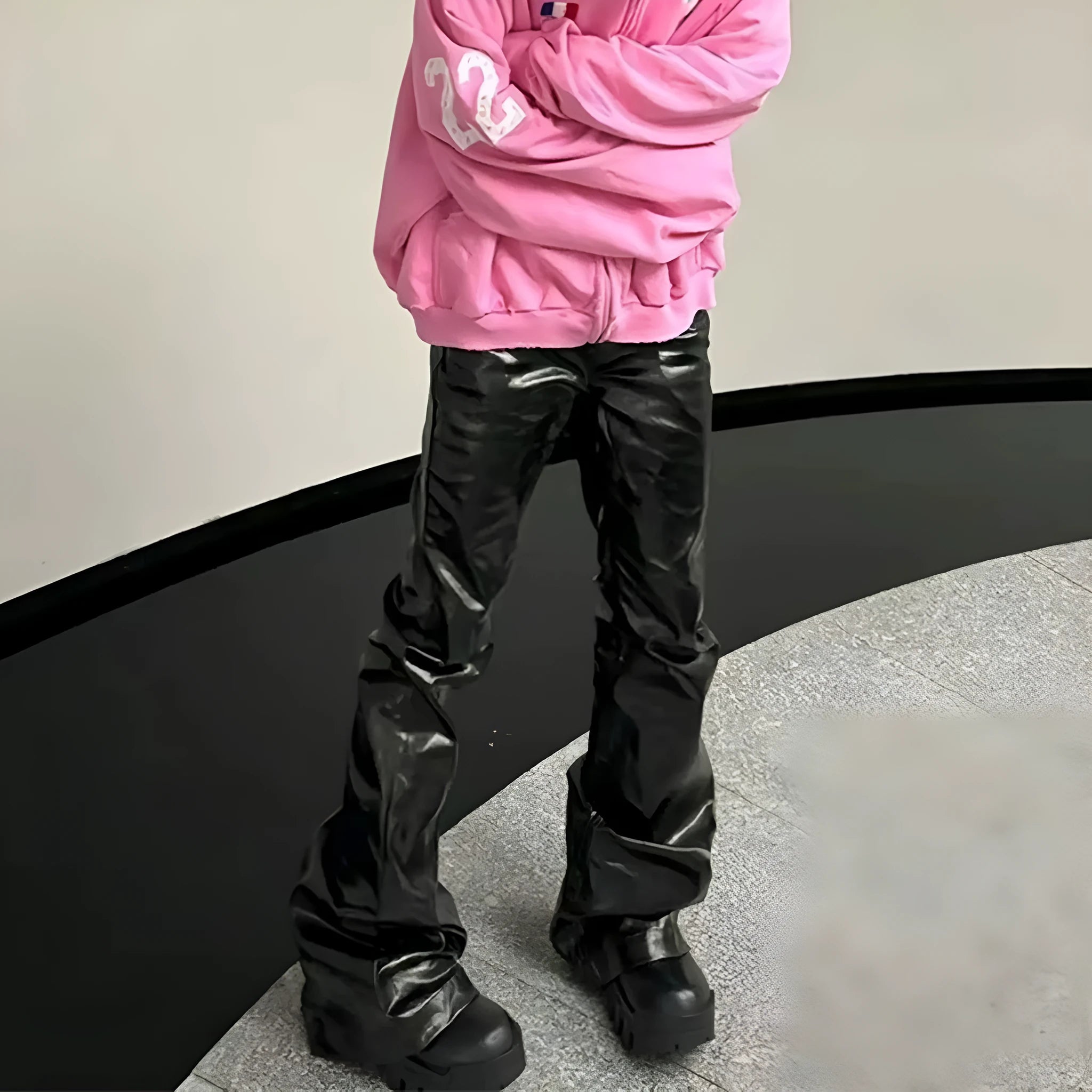 Black shiny patent leather skinny jeans with straight leg cut and mid waist design