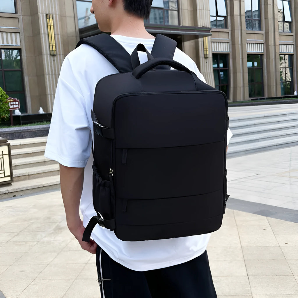 Women's lightweight waterproof solid colour travel backpack in grey with curved shoulder straps and stitching detail