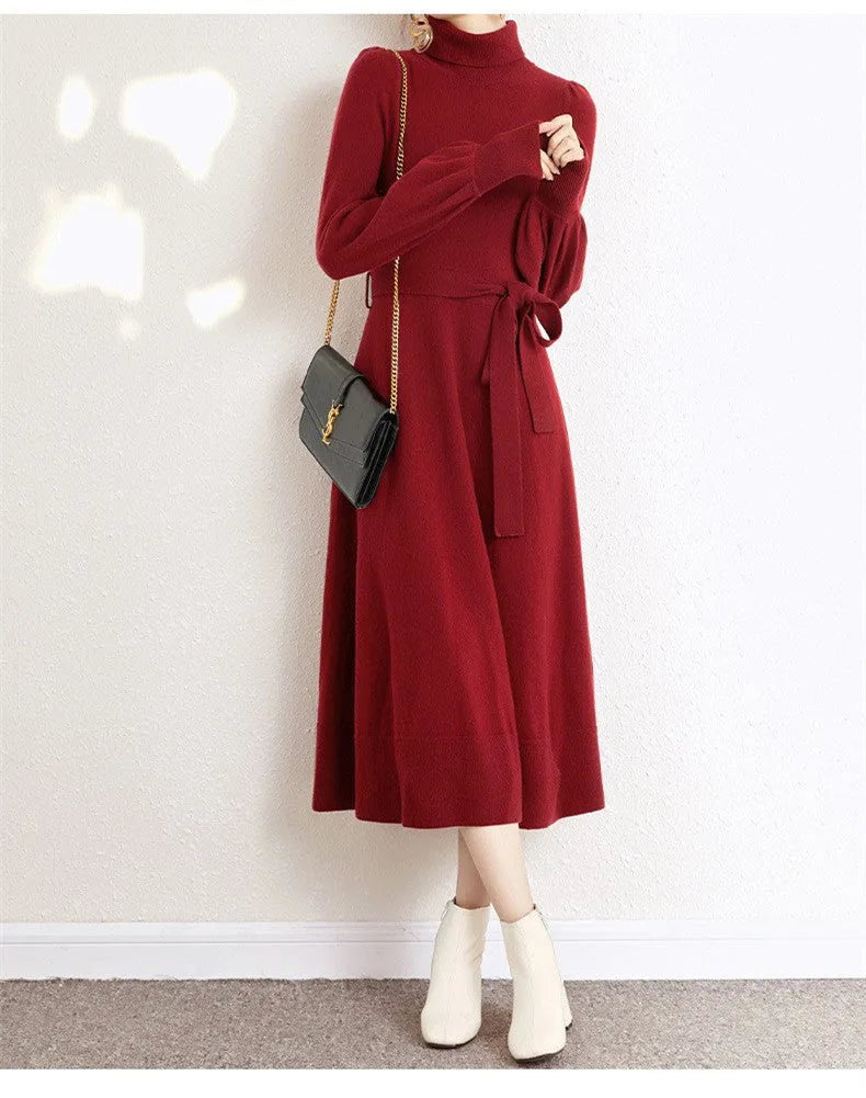 Rose red knit dress with a turtleneck collar, long sleeves, an elastic waist, and a loose big-hemmed midi skirt.