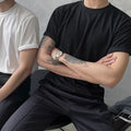 Men's slim fit cotton t-shirt in black on a white background.