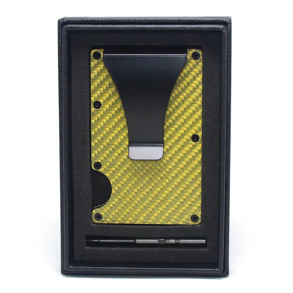Slim black carbon fibre card holder wallet with geometric design on a table.