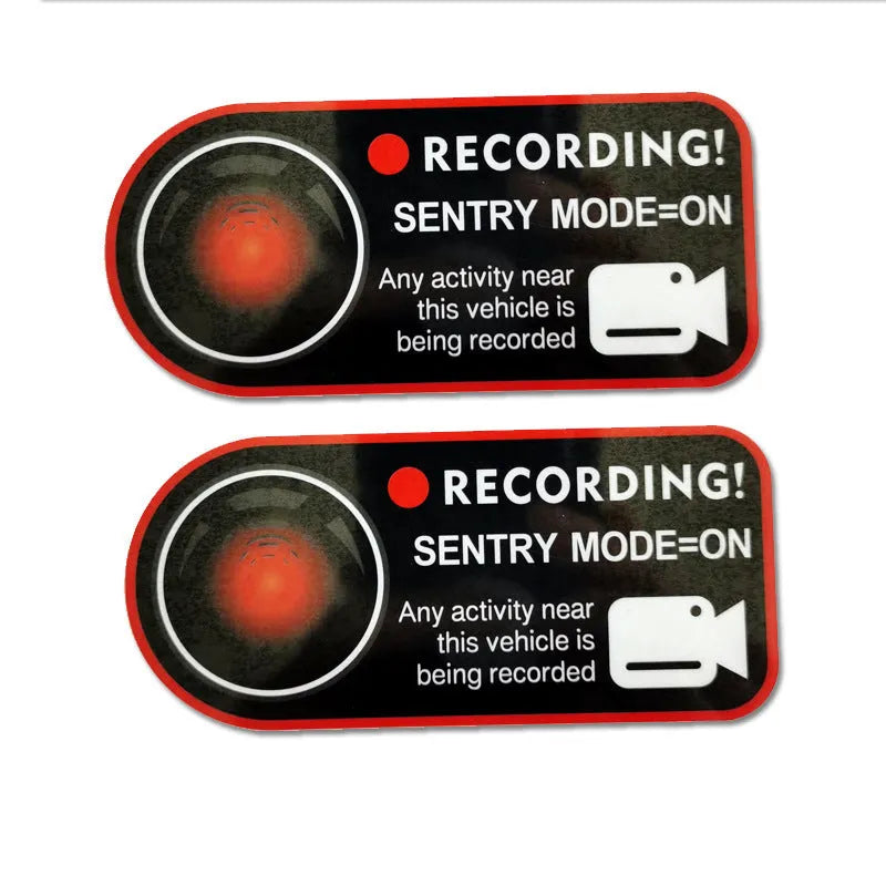 Tesla Sentry Mode electrostatic warning sticker measuring 11 by 5 centimetres
