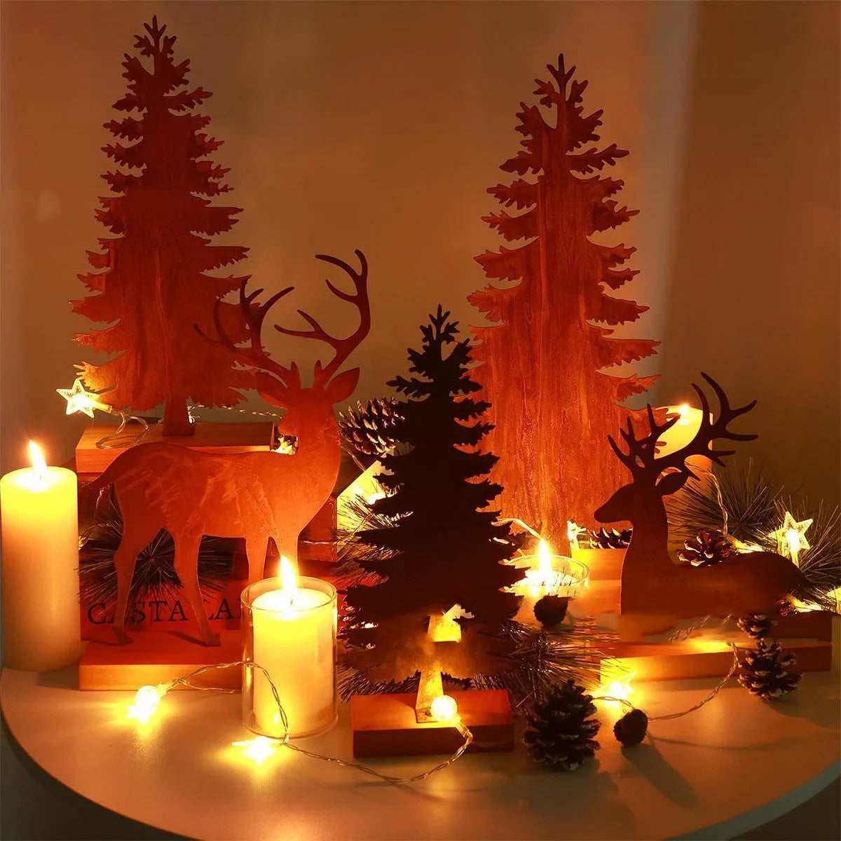 Three rusty iron Christmas decorations with elk and tree designs for rustic seasonal display