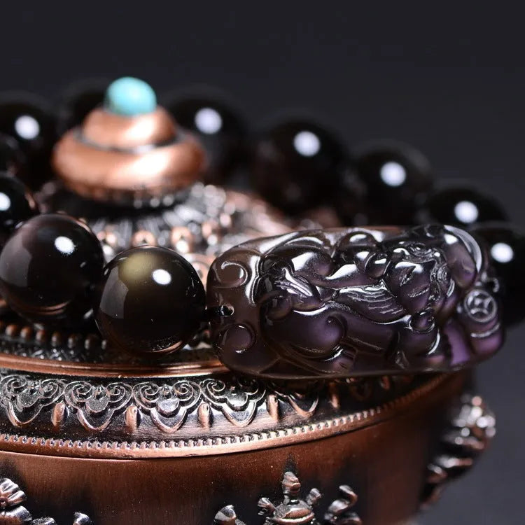 Natural icy obsidian Pi Xiu bracelet with double-eye ice stone colour on a geometric bead design.