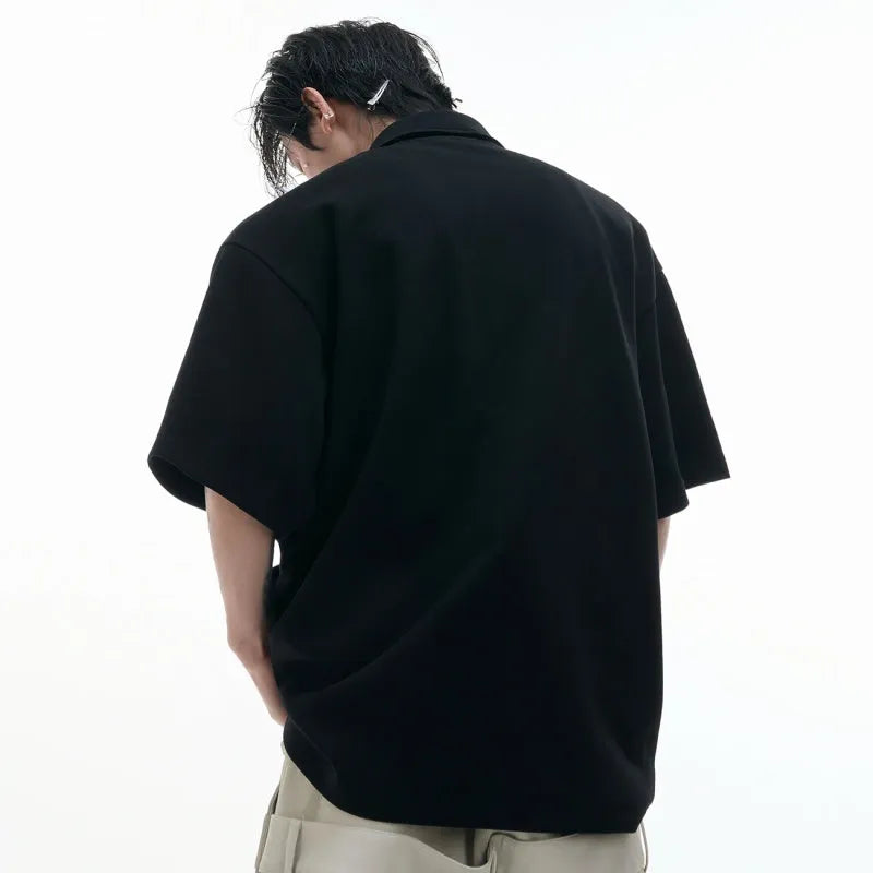 Men's deconstructed collar polo shirt with geometric pattern in polyester fabric, showing shirt collar detail and short sleeves