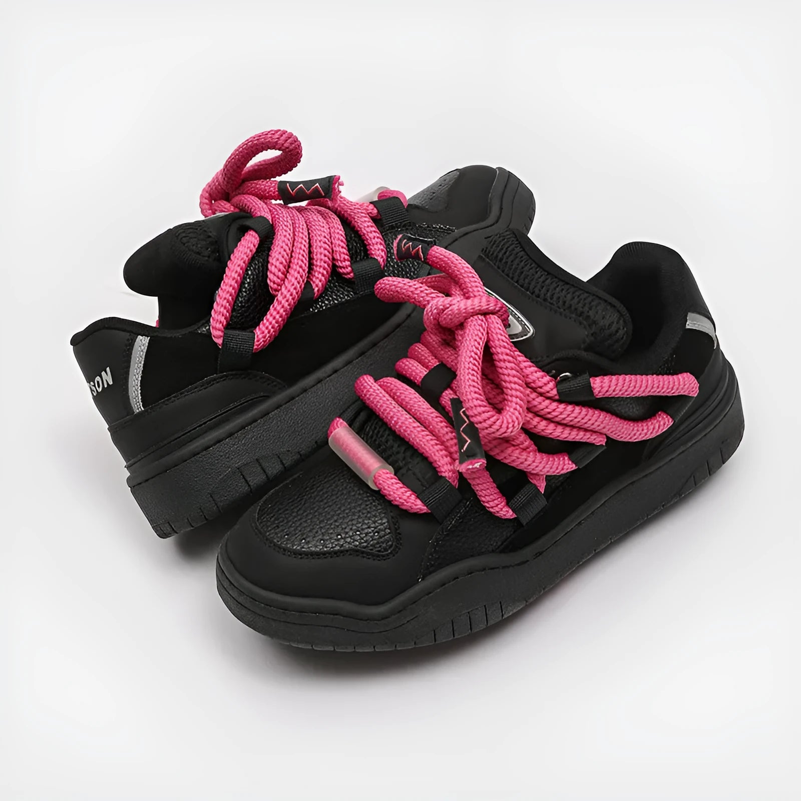 Pair of casual unisex lace-up shoes with thick rubber sole, shown in a choice of colours.