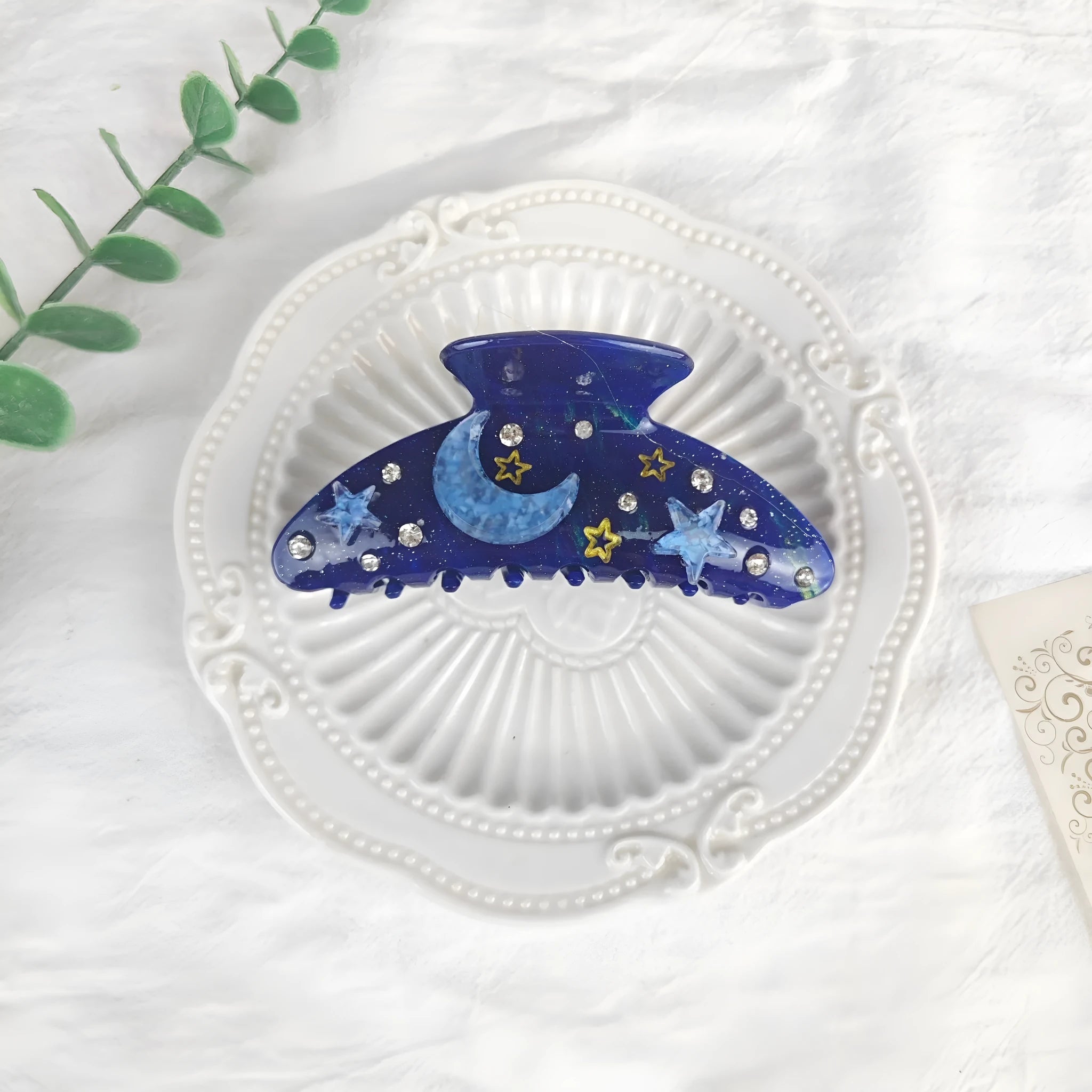 Oversized women's hair barrette with a starry sky pattern in sky blue.