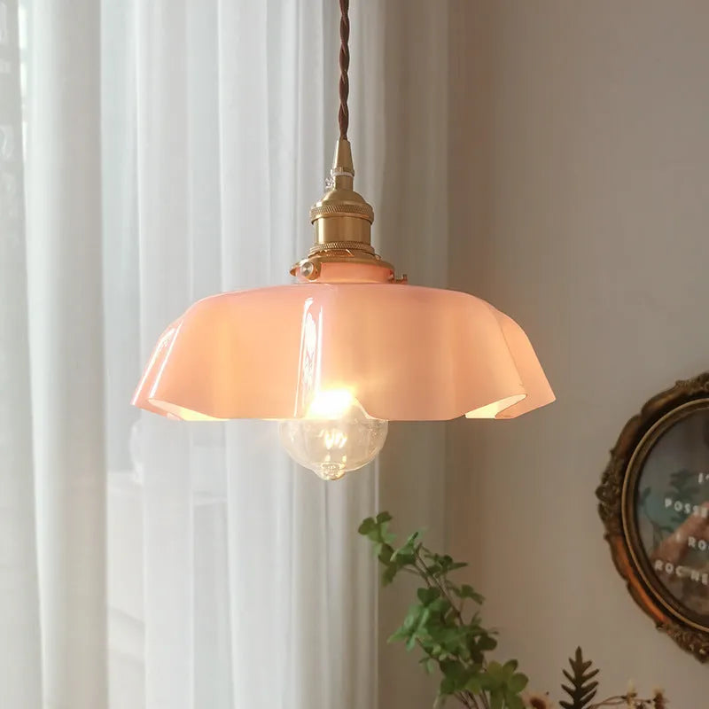 Medieval French style brass chandelier with flower bud details and glass lamp body