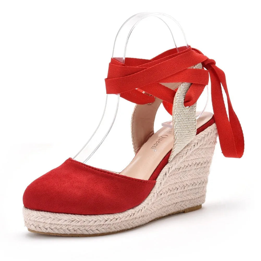 Women's apricot bohemian wedge sandals with bead decorations, tassels, and a buckle fastener on a white background.