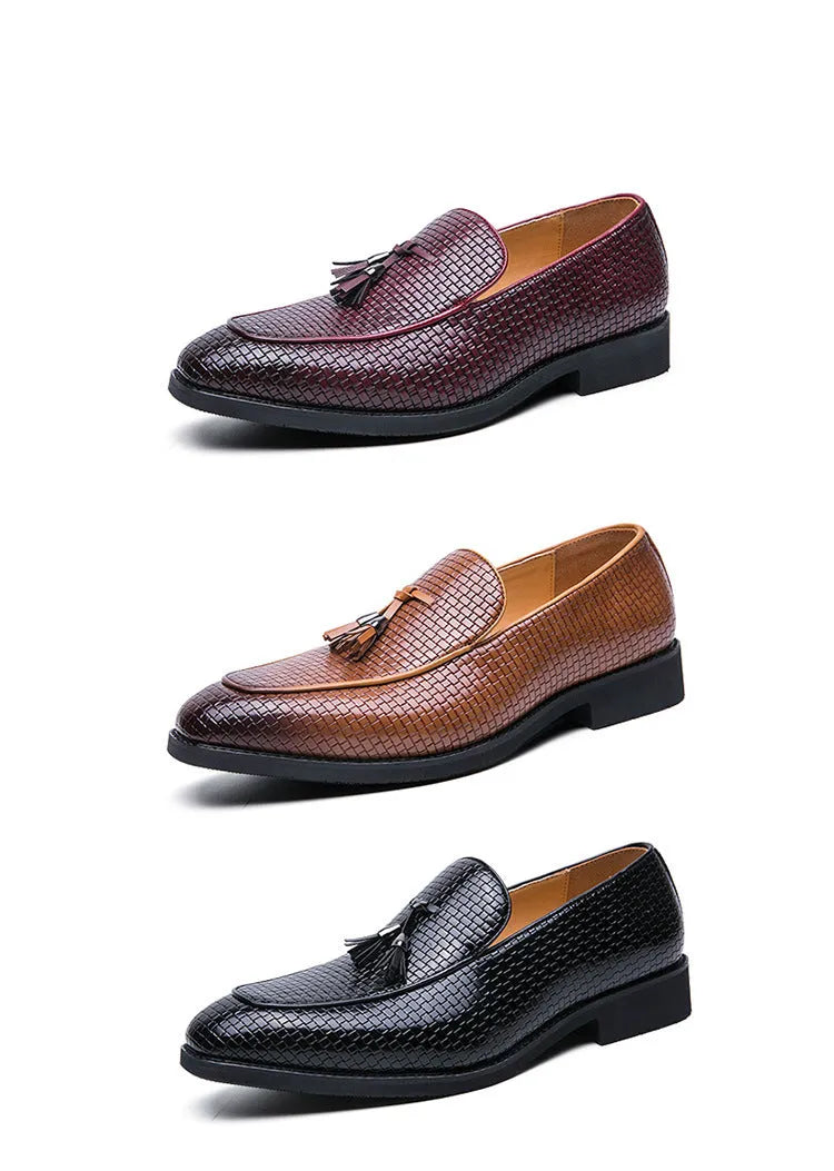 Men's black pointed-toe slip on shoes with a tassel detail on the low-top PU upper.