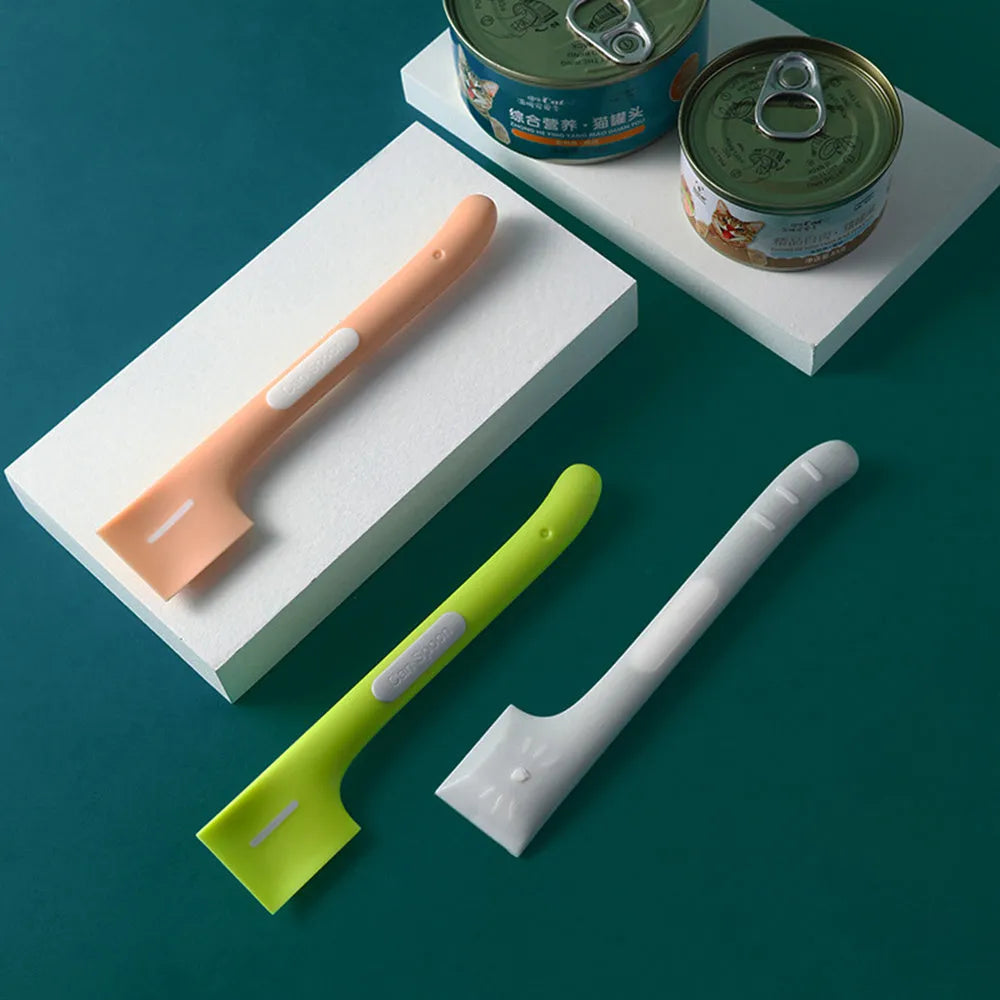 Green long-handled pet feeding spoon for scraping canned cat or dog food