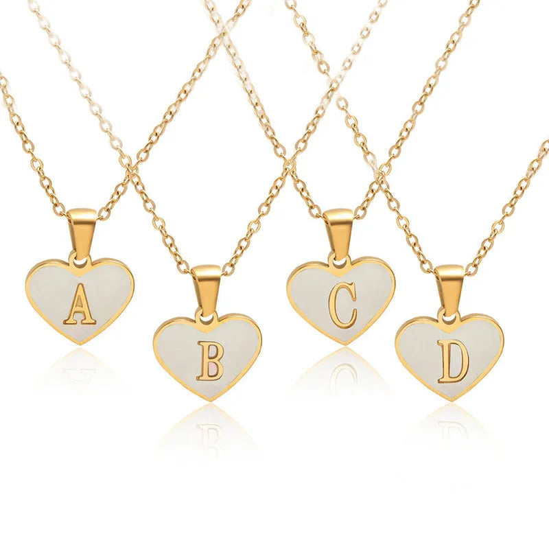 Gold-plated heart necklace with white shell design on adjustable stainless steel chain