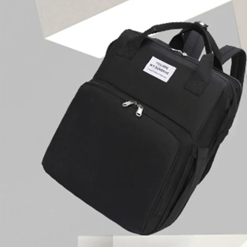 Portable lightweight nylon folding baby changing bag with USB port and shoulder strap in selected colour.