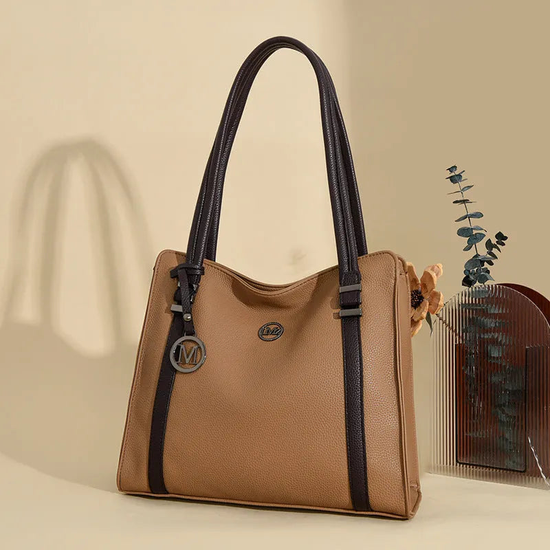 Women's soft black PU leather retro crossbody bag showing double straps and horizontal square shape.