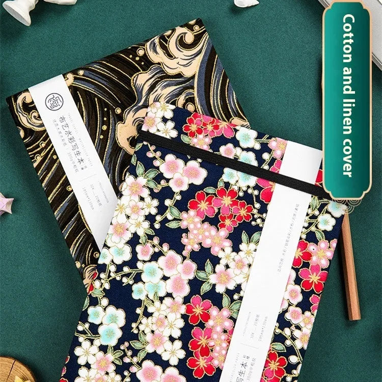 Feiluniao handmade fabric watercolour notebook in 185mm portable size, showing artistic cover design.