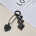 Fart Peach Love electroplated acrylic key ring with heart pattern in black, gold or white