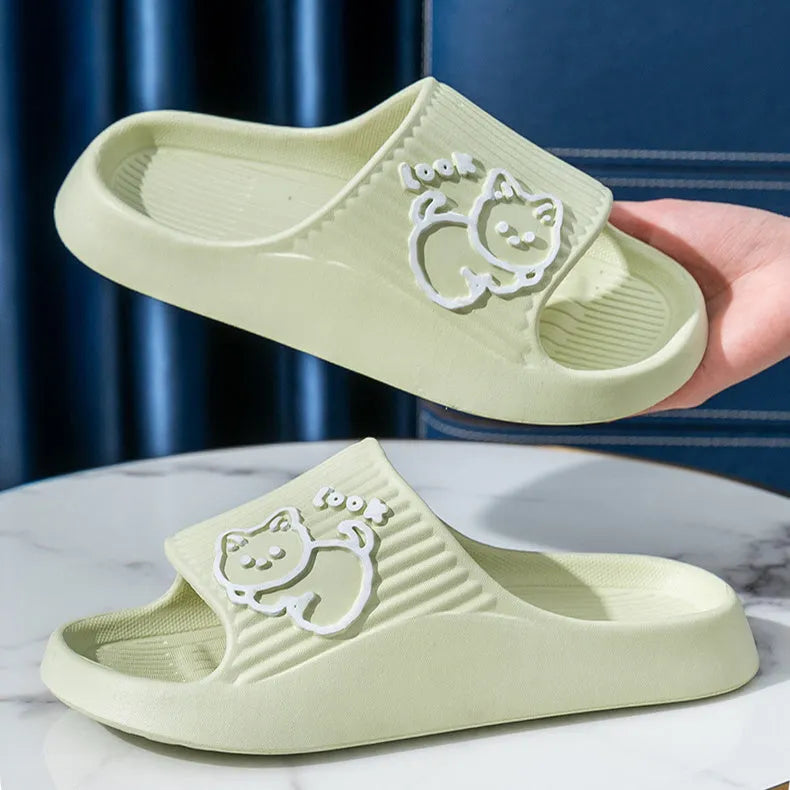 Women's pink cat-themed flip-flop slippers with a thick light blue EVA platform sole.