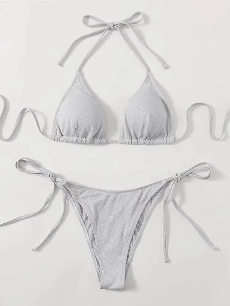 Women's bandage-style bikini swimsuit in black, shown as a two-piece set.