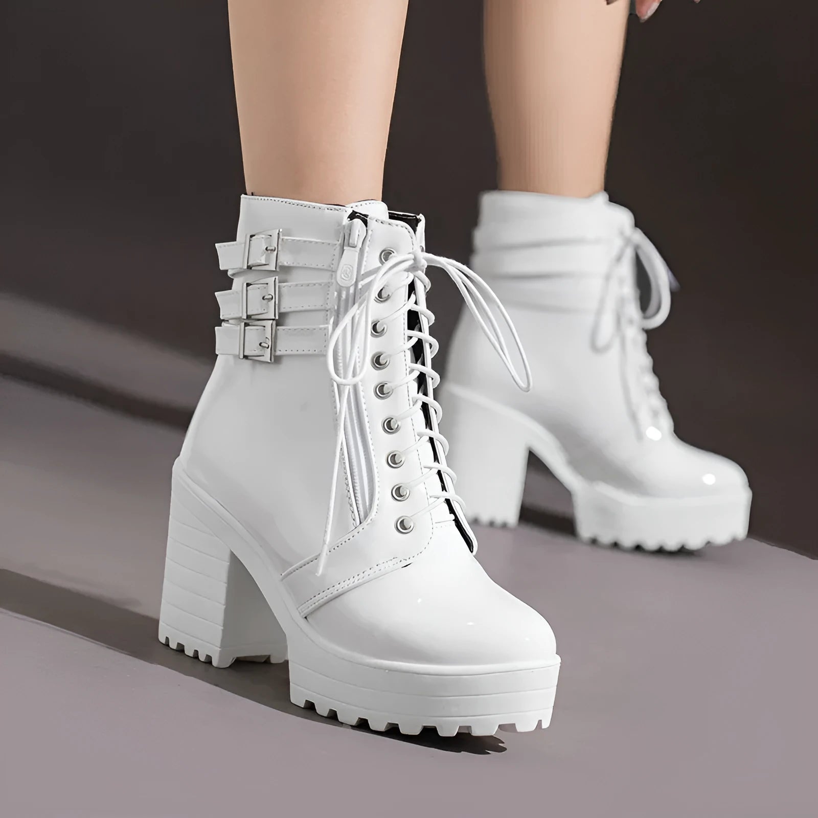 Women's black lace-up platform ankle boots with a round toe and a thick rubber sole.