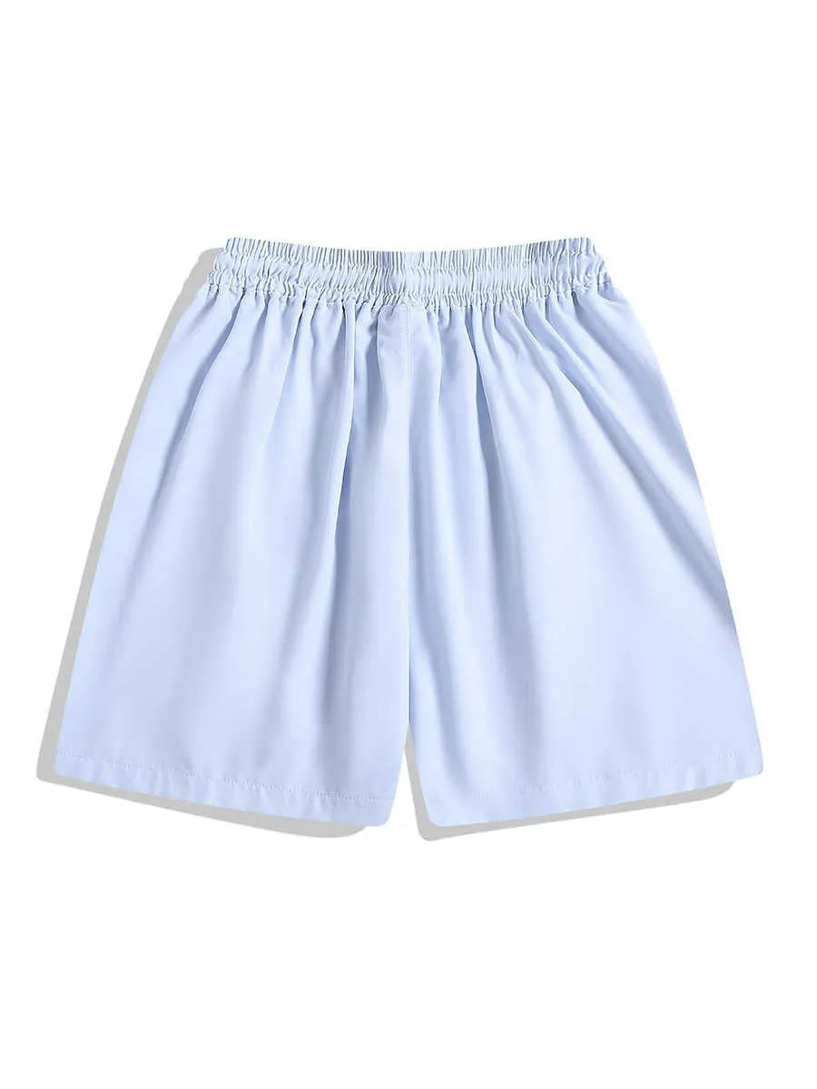 Man wearing loose-fit black quick-dry sports shorts with an elastic waistband.