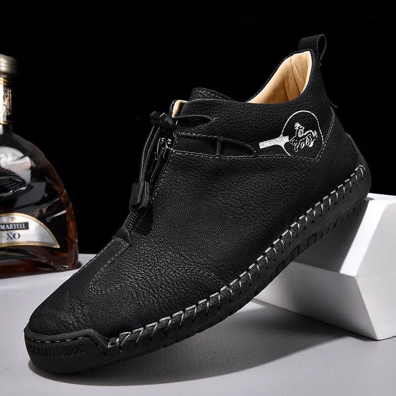 Men's black casual leather shoes with round toe and mid heel on a rubber sole