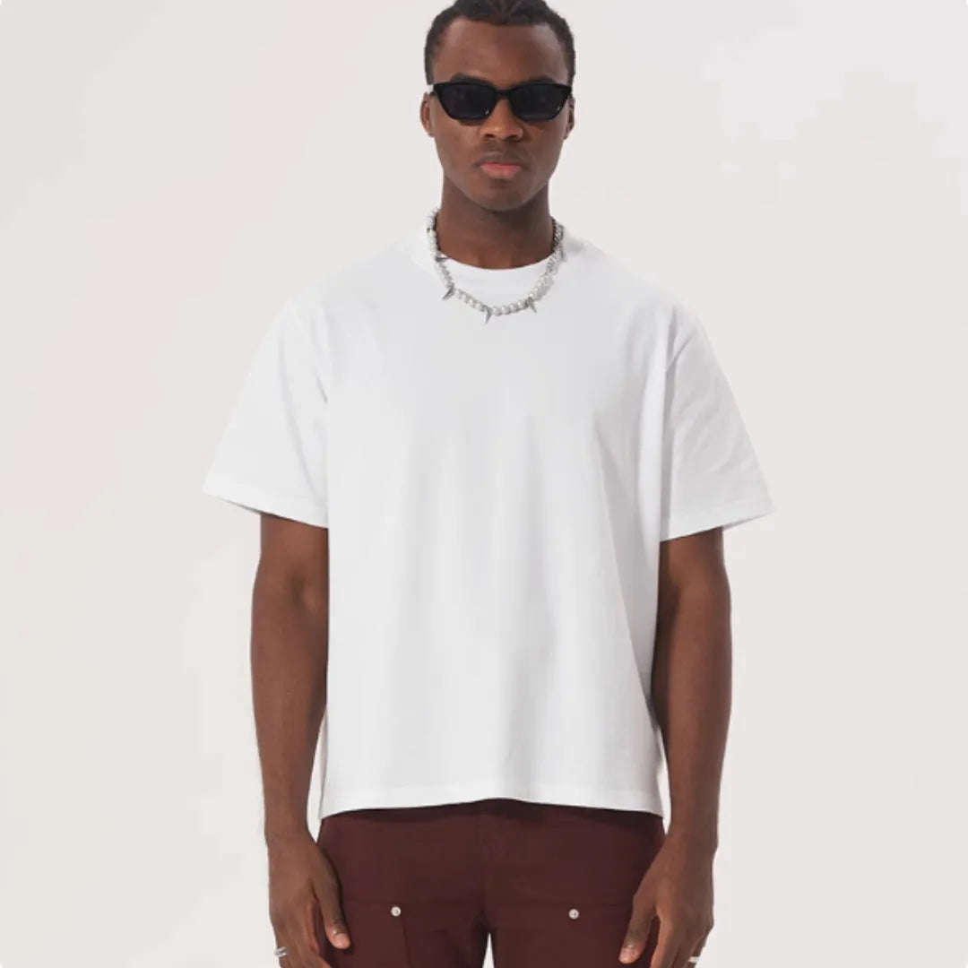 Man wearing a loose-fit apricot coloured pure cotton t-shirt, American style, short sleeves.