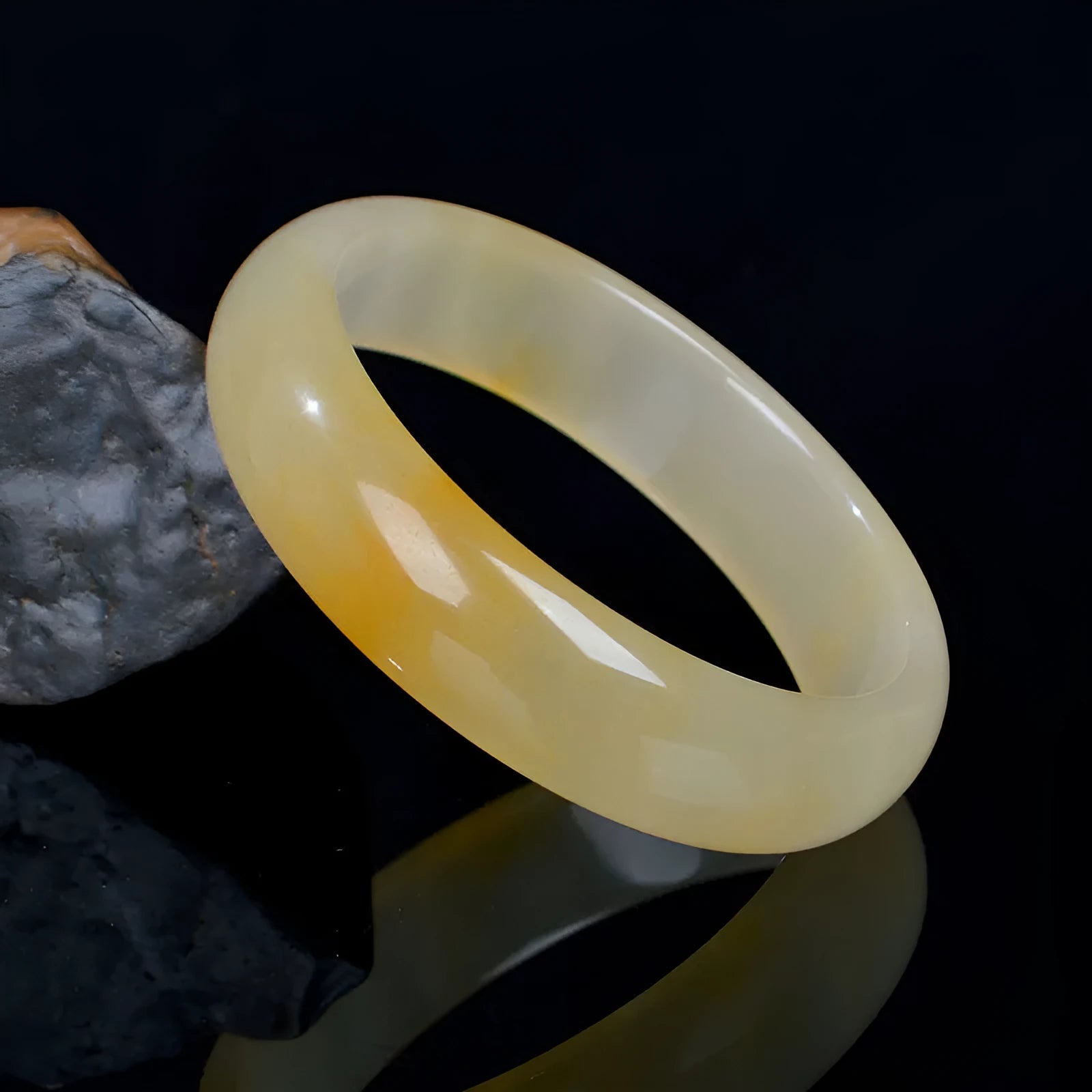A polished light jade bracelet for women, shown in a Chinese style, with size options from 54mm to 62mm.