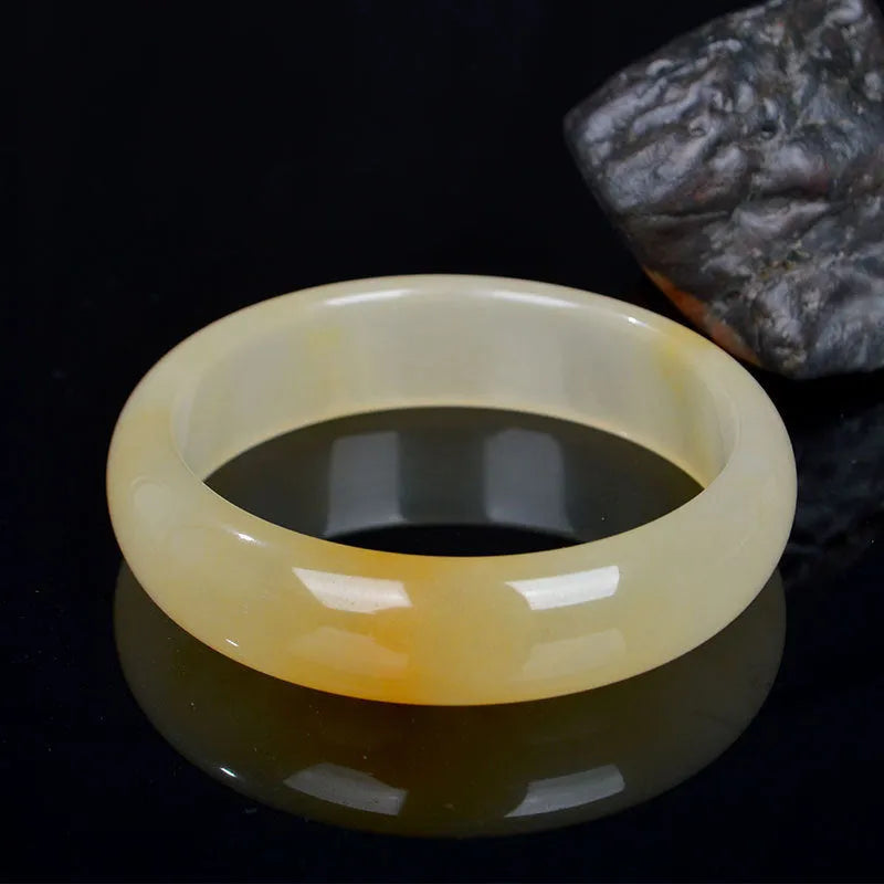 A polished light jade bracelet for women, shown in a Chinese style, with size options from 54mm to 62mm.