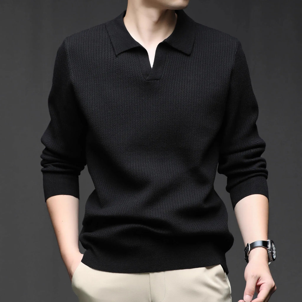 Men's loose green pullover sweater on a hanger, casual autumn wear
