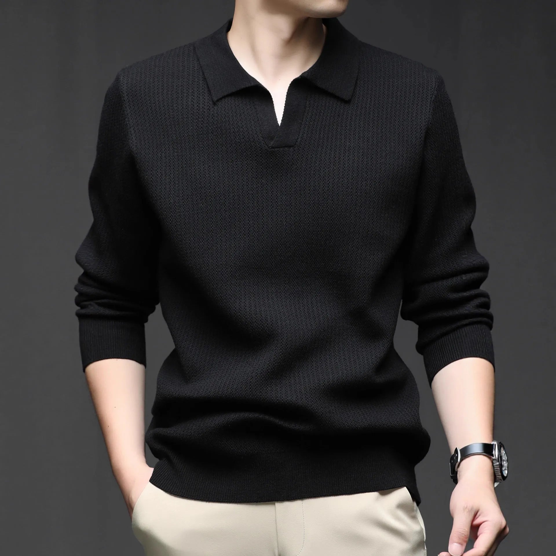 Men's loose green pullover sweater on a hanger, casual autumn wear
